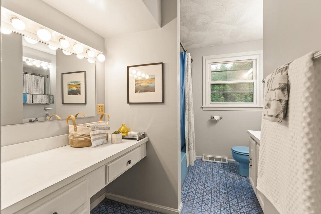 15 1/2 Algonquin Road Canton, MA 02021 - Photo 28 of 37 a bathroom with a double vanity sink toilet and a tub