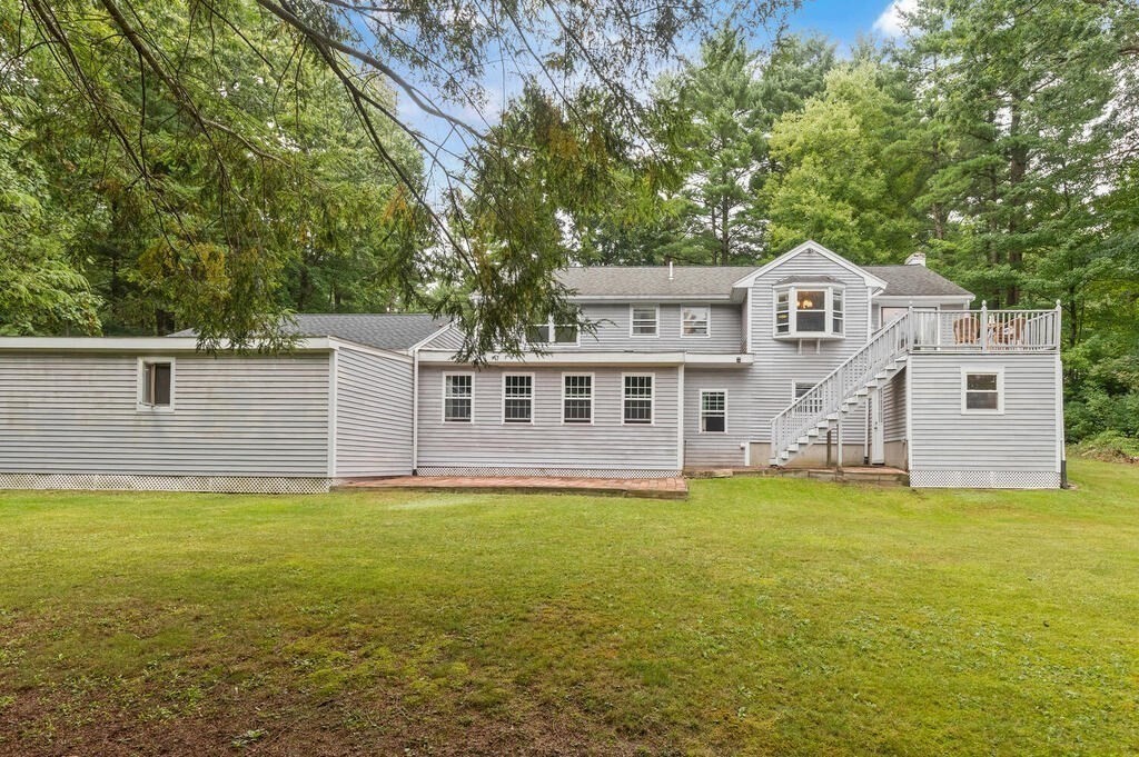 15 1/2 Algonquin Road Canton, MA 02021 - Photo 31 of 37 a front view of a house with a yard