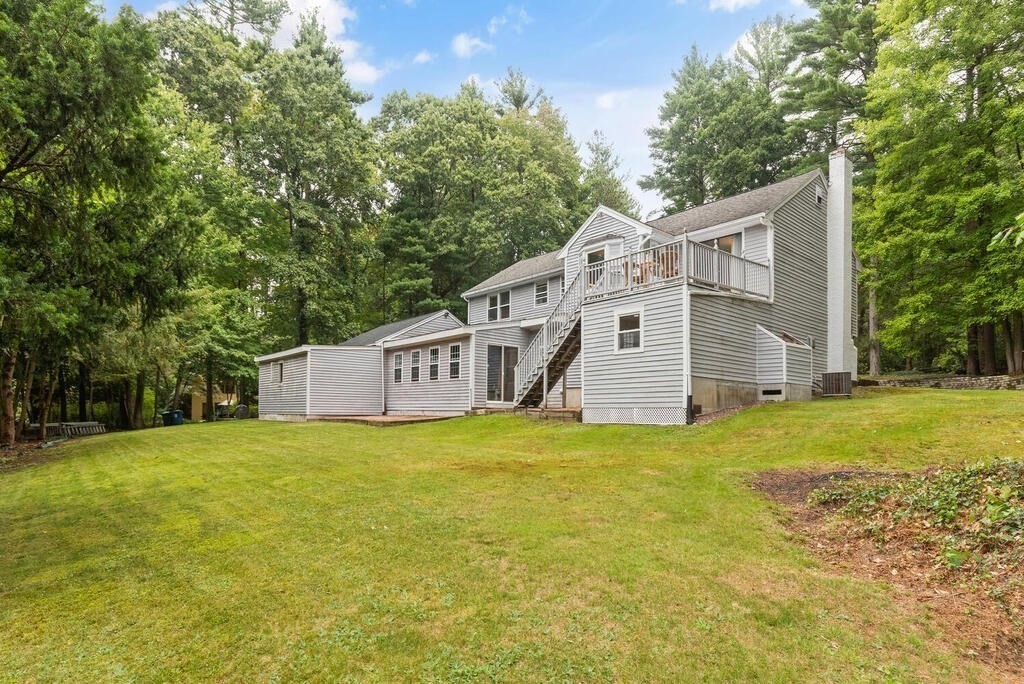 15 1/2 Algonquin Road Canton, MA 02021 - Photo 32 of 37 a house with a tree in front of it