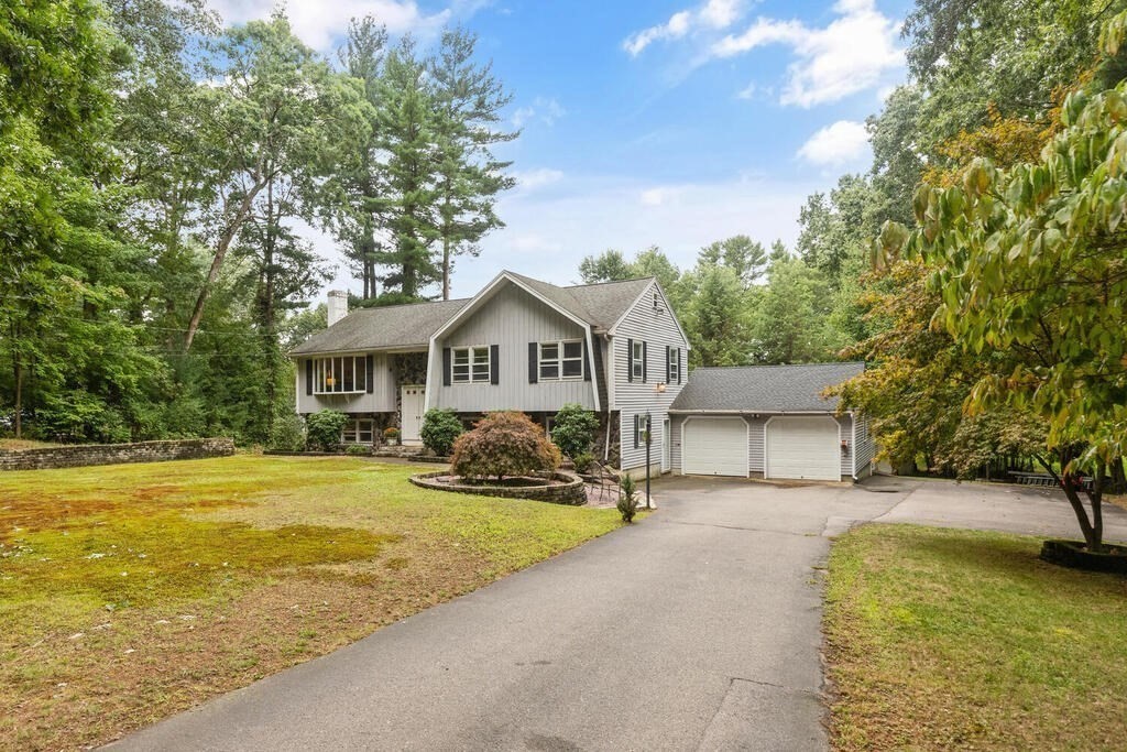 15 1/2 Algonquin Road Canton, MA 02021 - Photo 35 of 37 a front view of a house with a yard