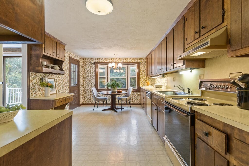 15 1/2 Algonquin Road Canton, MA 02021 - Photo 8 of 37 a kitchen with sink stove and cabinets