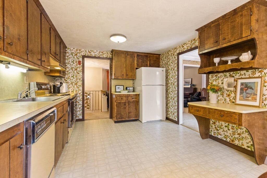 15 1/2 Algonquin Road Canton, MA 02021 - Photo 10 of 37 a kitchen with refrigerator and cabinets