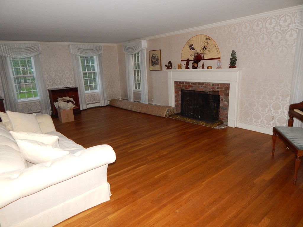 266 Old Pickard Road Concord, MA 01742 - Photo 8 of 30 a living room with furniture and a fireplace