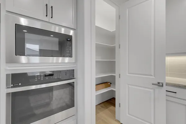 a kitchen with a stove and a microwave