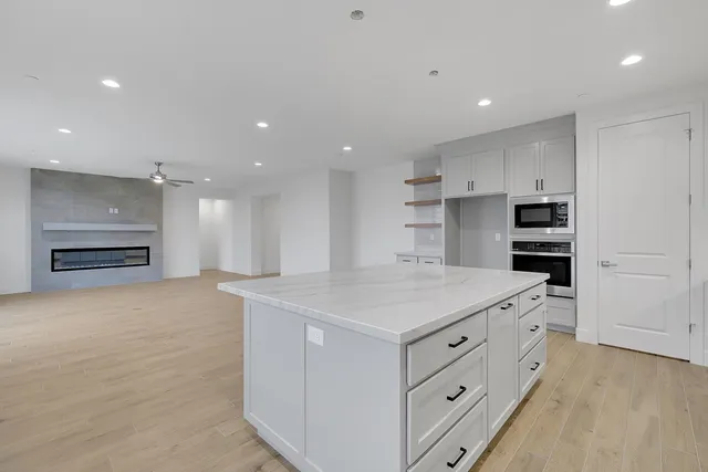 a kitchen with a stove and a refrigerator