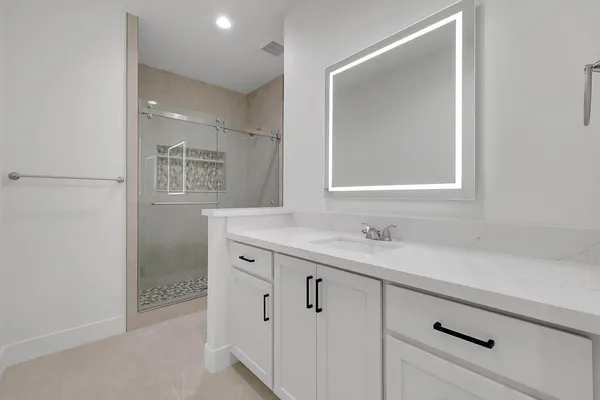 a bathroom with a sink and a mirror