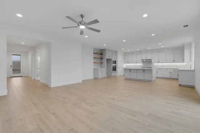 a view of a kitchen with a stove cabinets and a kitchen
