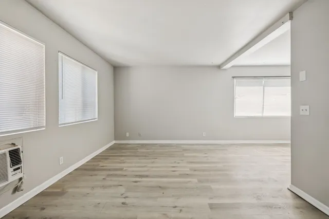 a view of an empty room with a window