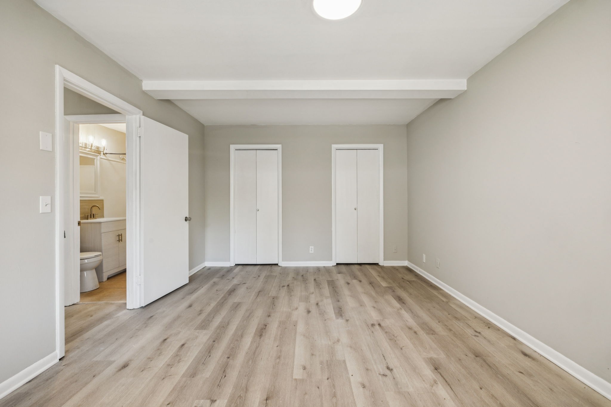 550 Harding Place, Unit D113 Nashville, TN 37211 - Photo 15 of 20 wooden floor in an empty room with a window