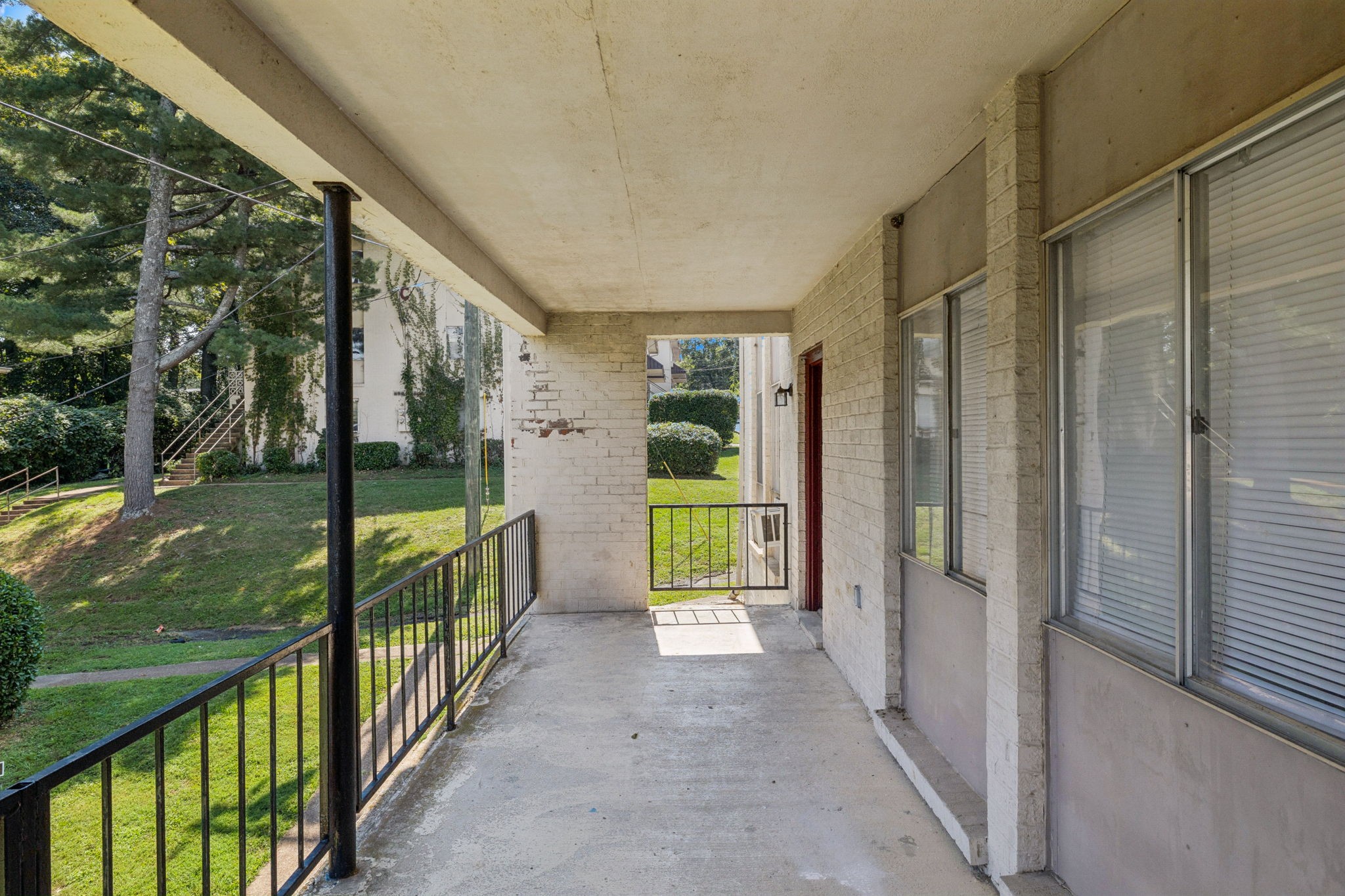 550 Harding Place, Unit D113 Nashville, TN 37211 - Photo 17 of 20 a view of porch with garden