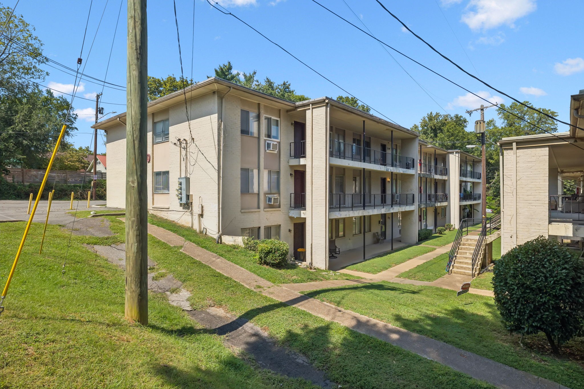 550 Harding Place, Unit D113 Nashville, TN 37211 - Photo 20 of 20 a view of a house with a big yard and potted plants