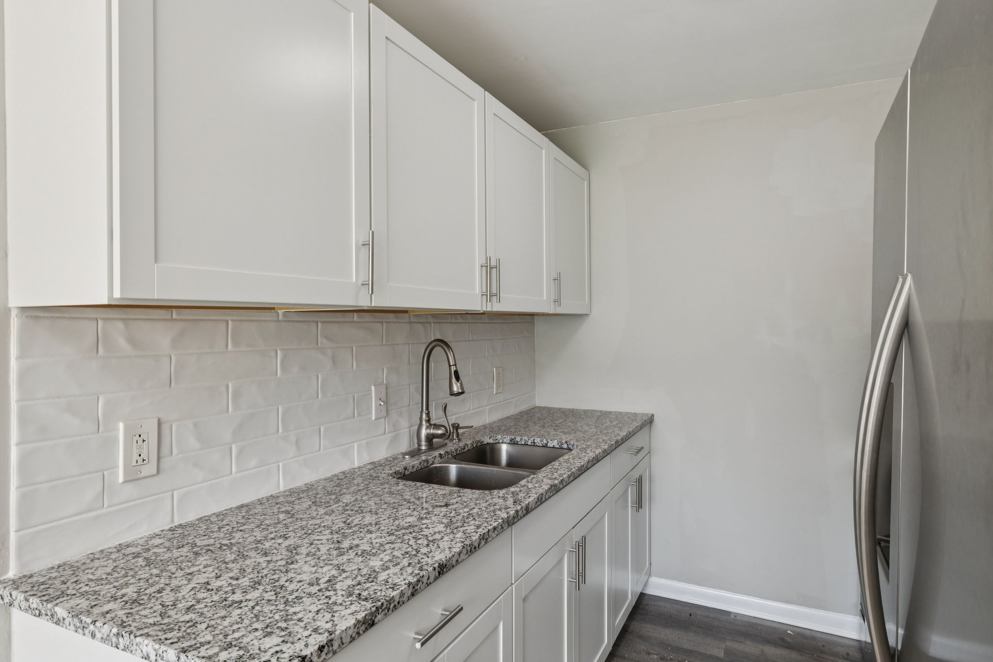 550 Harding Place, Unit D113 Nashville, TN 37211 - Photo 9 of 20 a kitchen with stainless steel appliances granite countertop a sink stove and refrigerator