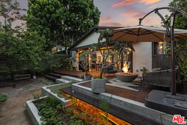 a view of a chairs and table in the patio