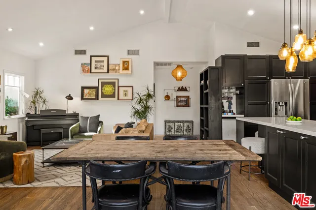 a dining table with chairs and window