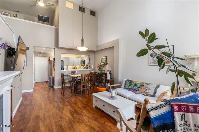 a living room with lots of furniture and a chandelier