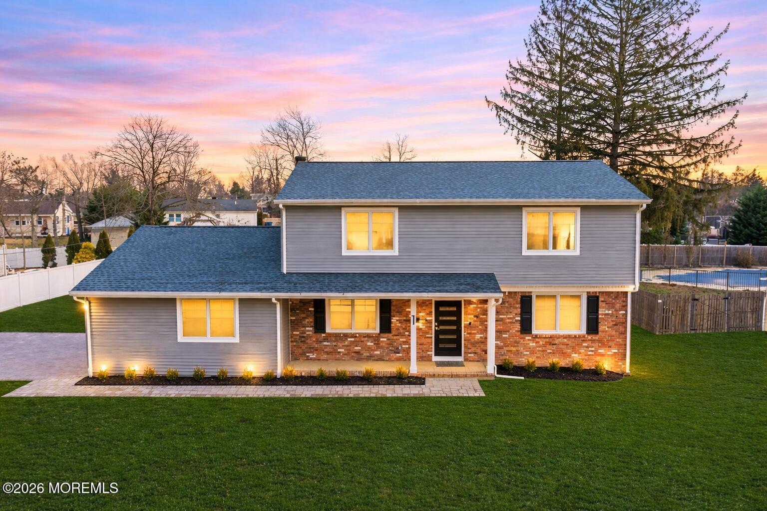 1 Robin Drive Oakhurst, NJ 07755 - Photo 1 of 42 a front view of a house with a yard