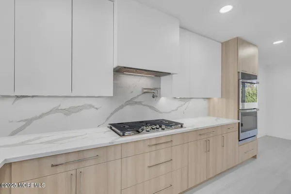 a kitchen with counter top space and appliances