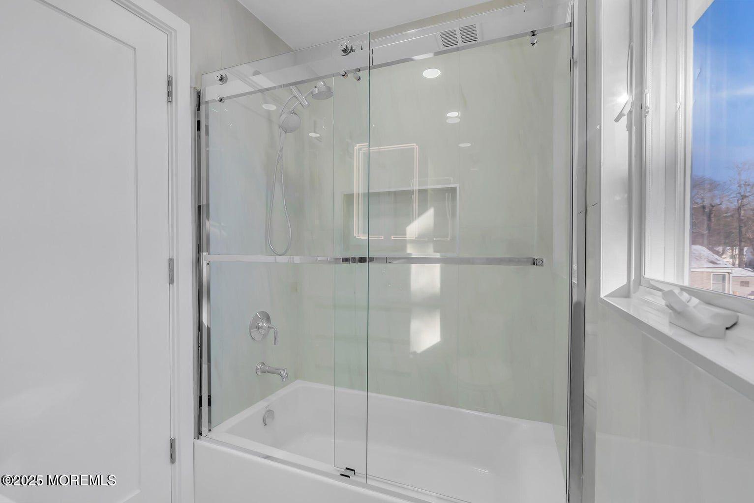 1 Robin Drive Oakhurst, NJ 07755 - Photo 20 of 42 a bathroom with a glass shower door