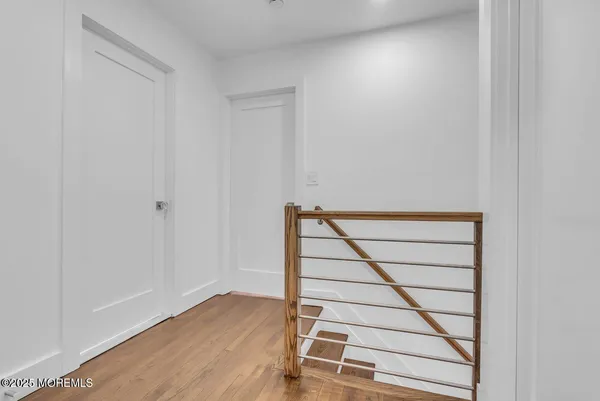 a view of room with wooden floor and window