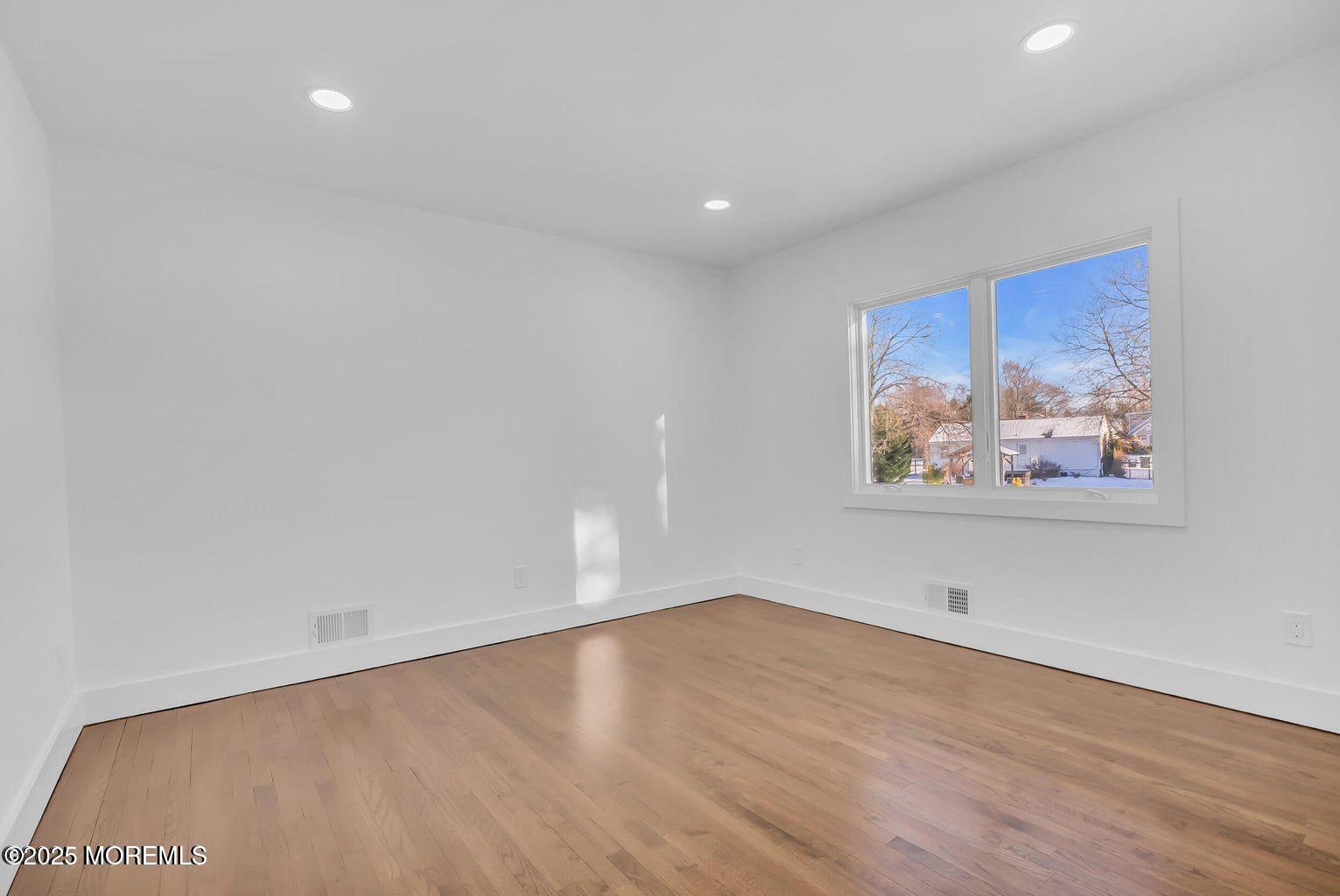 1 Robin Drive Oakhurst, NJ 07755 - Photo 26 of 42 a view of room with wooden floor and window