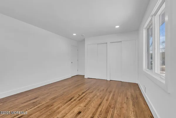 a bathroom with a shower and a glass door