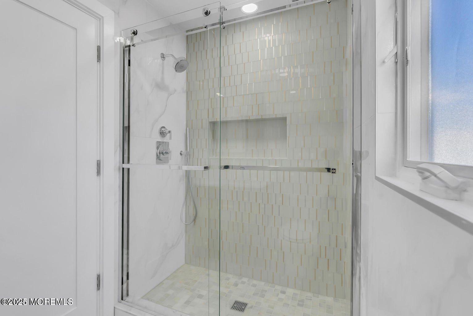 1 Robin Drive Oakhurst, NJ 07755 - Photo 33 of 42 a bathroom with a shower and a glass door