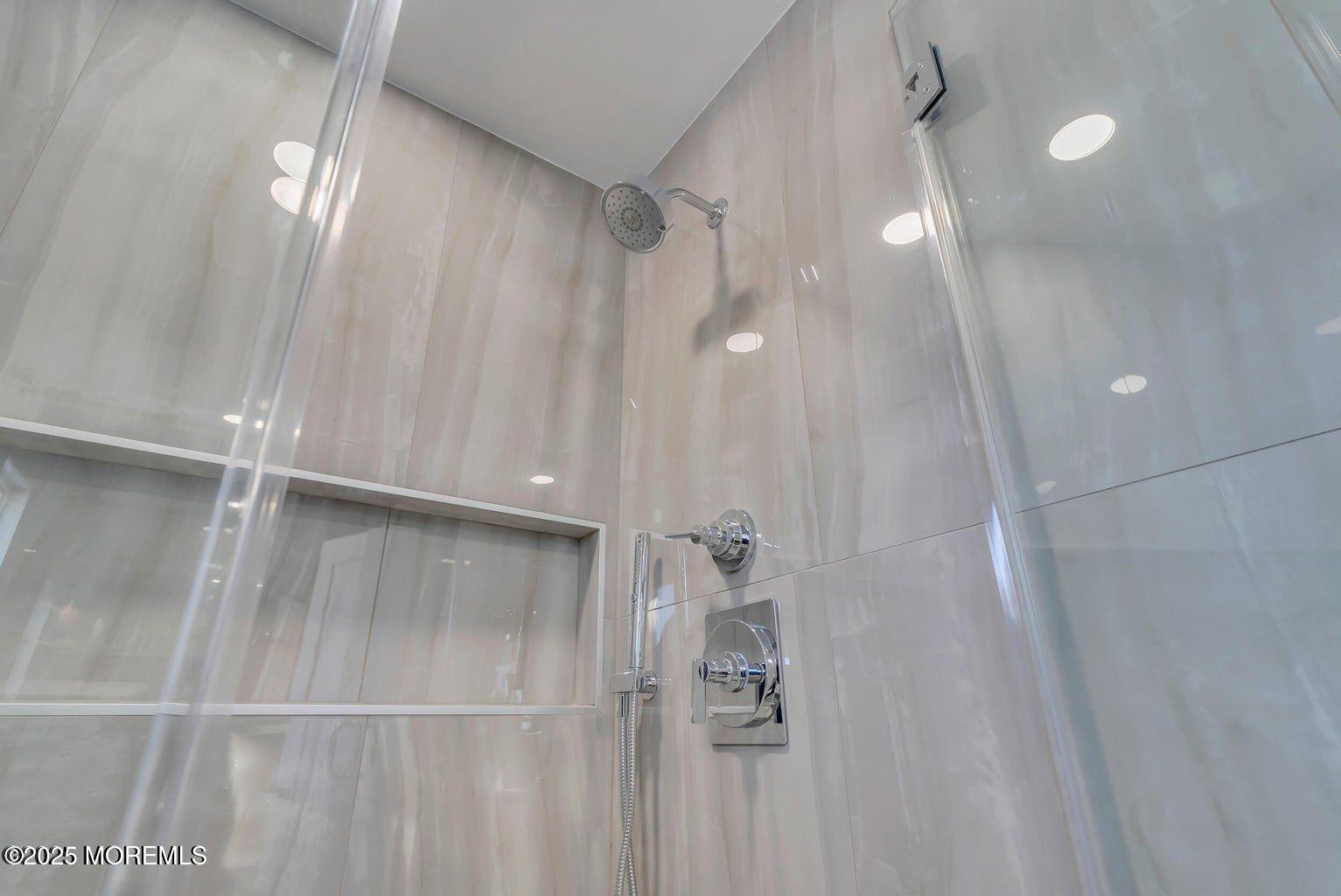 1 Robin Drive Oakhurst, NJ 07755 - Photo 38 of 42 a bathroom with a shower and a mirror