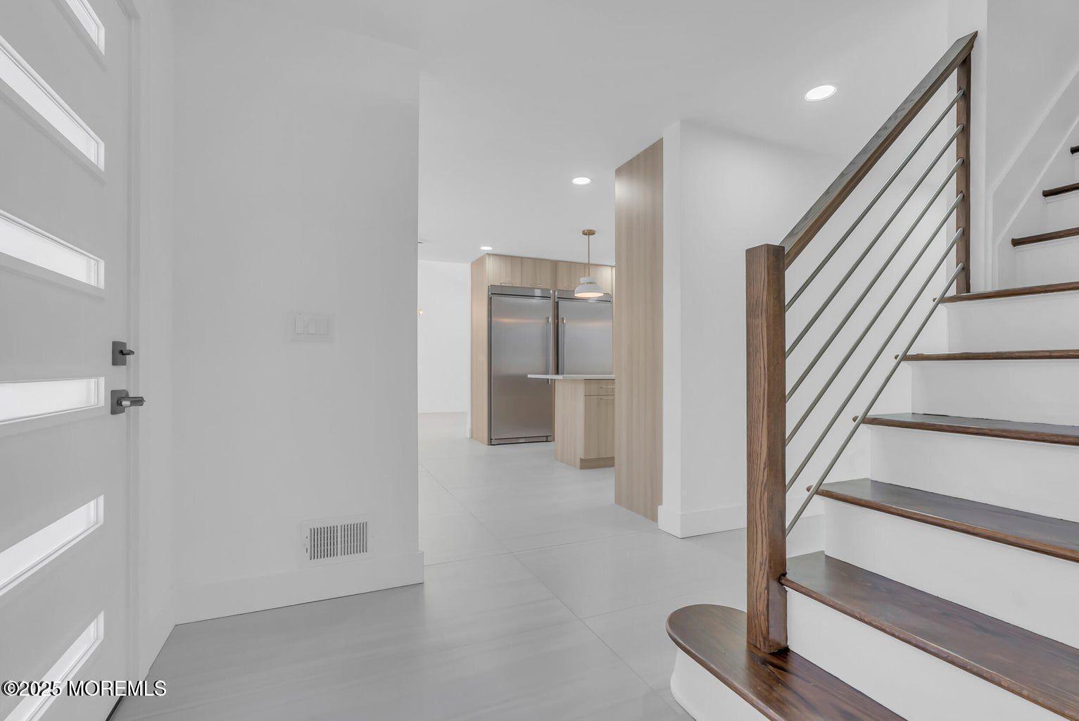 1 Robin Drive Oakhurst, NJ 07755 - Photo 6 of 42 a view of a hallway with staircase