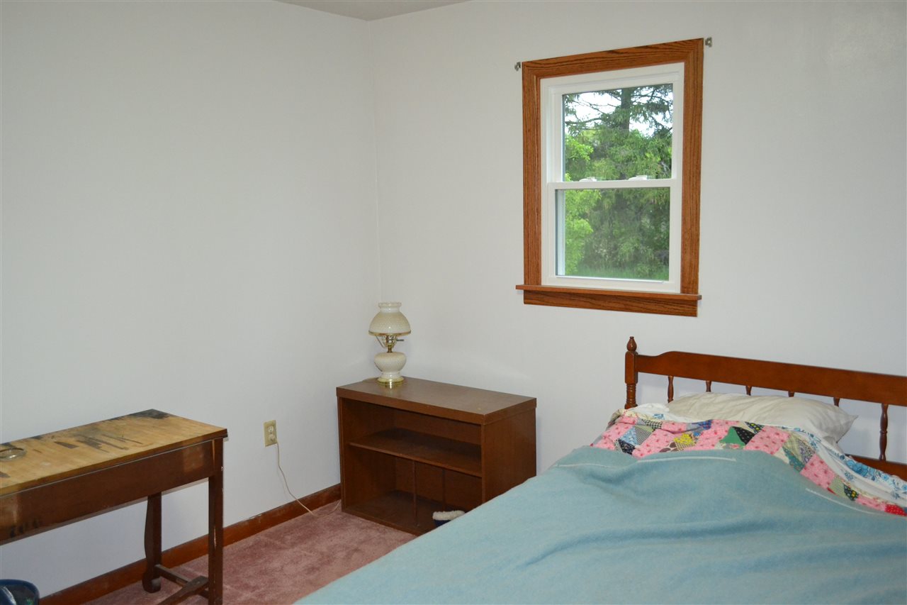 15898 Prairie Road South Beloit, IL 61080 - Photo 6 of 21 a bedroom with a bed and a window
