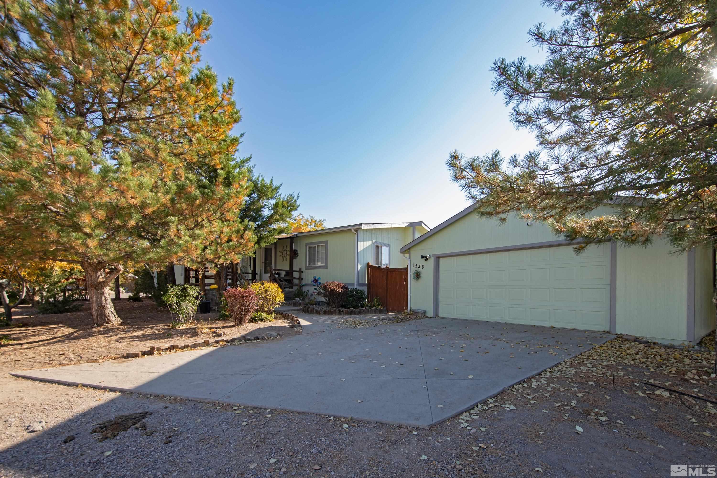 1536 King Lane Reno, NV 89521 - Photo 3 of 31 a view of a house with a snow in the yard