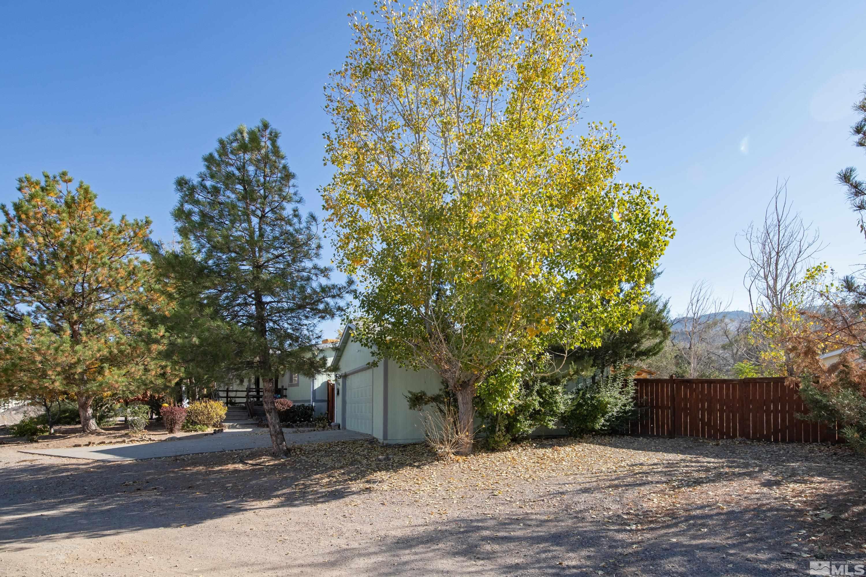 1536 King Lane Reno, NV 89521 - Photo 4 of 31 a view of a house with a tree