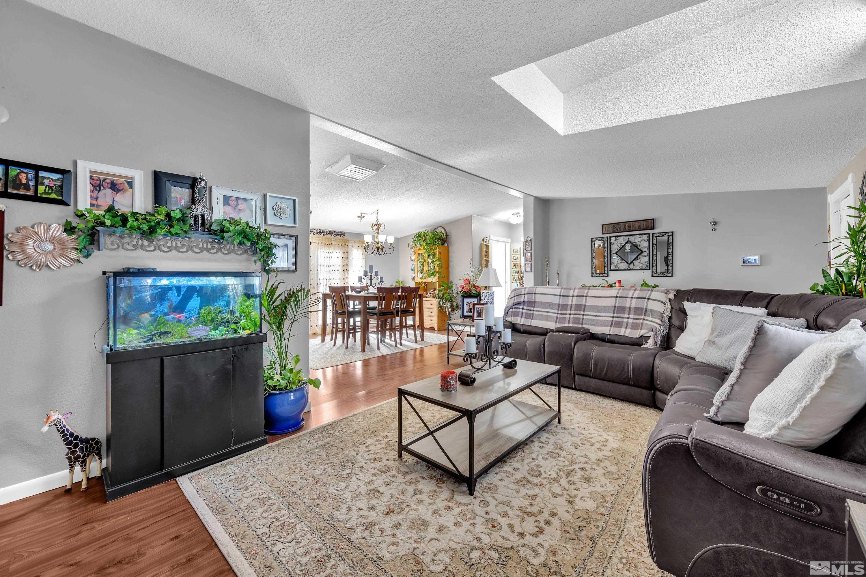 1536 King Lane Reno, NV 89521 - Photo 6 of 31 a living room with furniture and a dining area