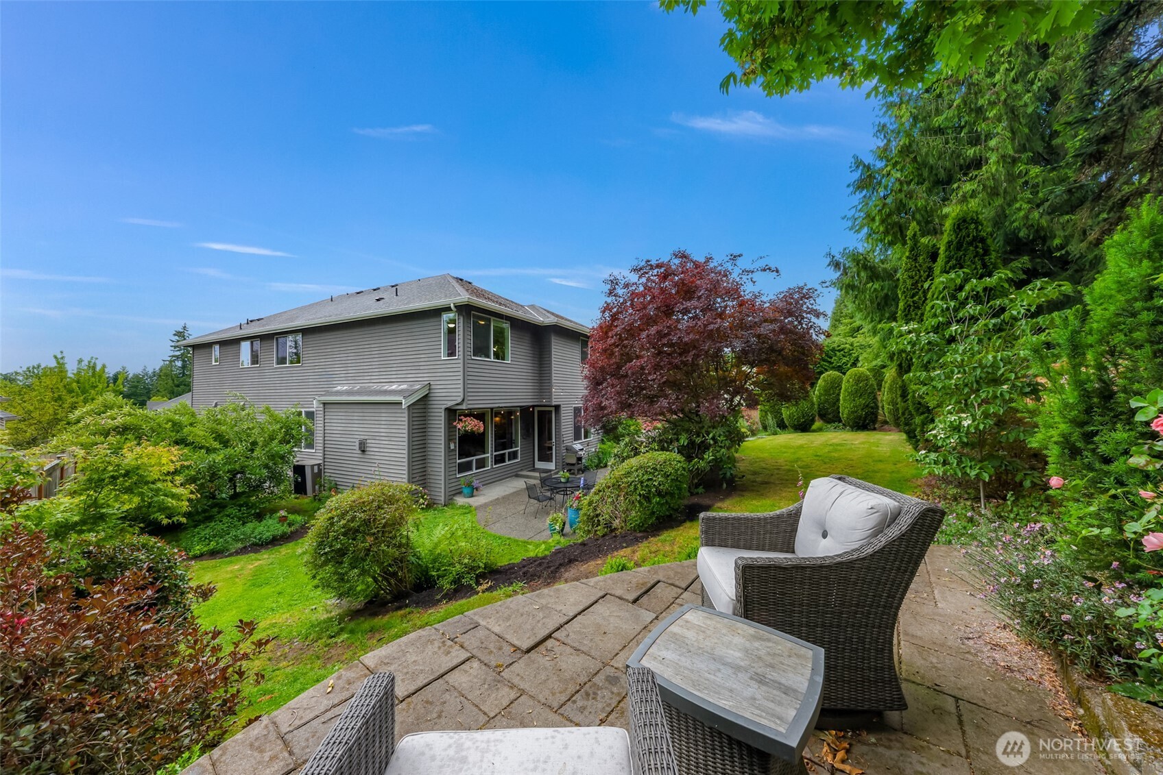 2029 240th Place Southeast Bothell, WA 98021 - Photo 36 of 39 a view of backyard with outdoor seating and green space