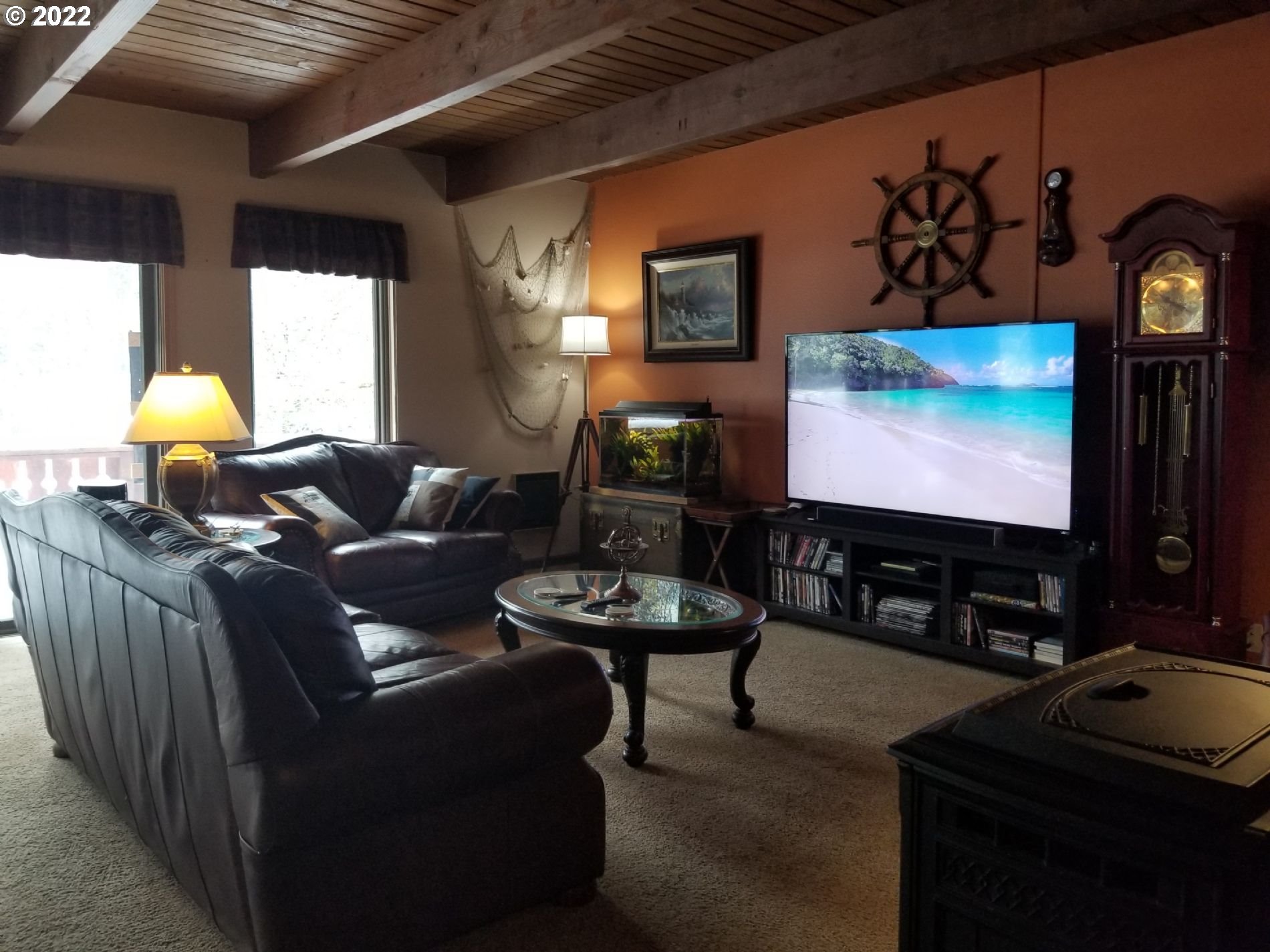 21545 Hideway Lane Rhododendron, OR 97049 - Photo 2 of 6 a living room with furniture and a flat screen tv