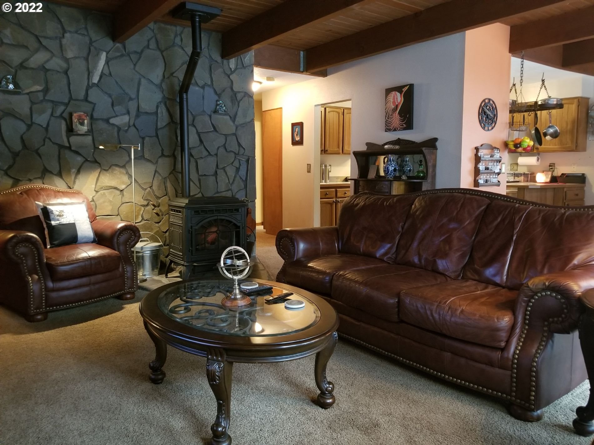21545 Hideway Lane Rhododendron, OR 97049 - Photo 3 of 6 a living room with furniture and a fireplace
