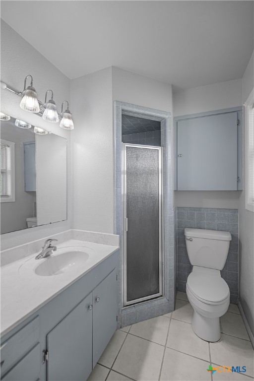 3104 Erwin Avenue Victoria, TX 77901 - Photo 12 of 19 a bathroom with a toilet sink and mirror