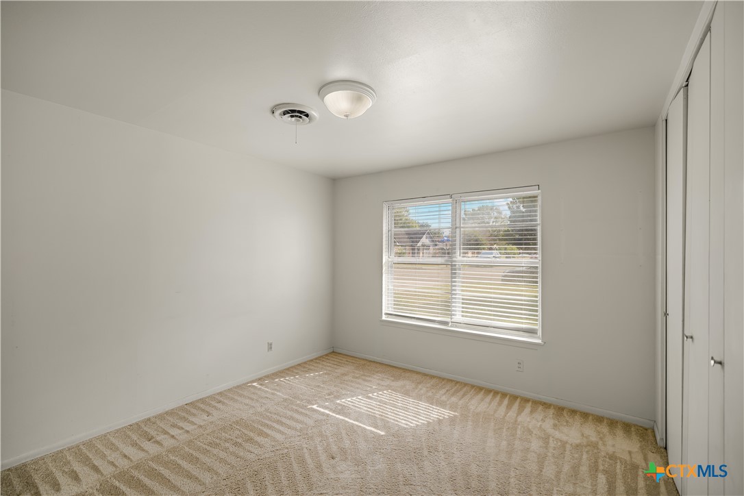 3104 Erwin Avenue Victoria, TX 77901 - Photo 8 of 19 a view of an empty room with a window