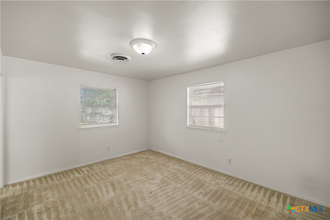 3104 Erwin Avenue Victoria, TX 77901 - Photo 10 of 19 an empty room with a window