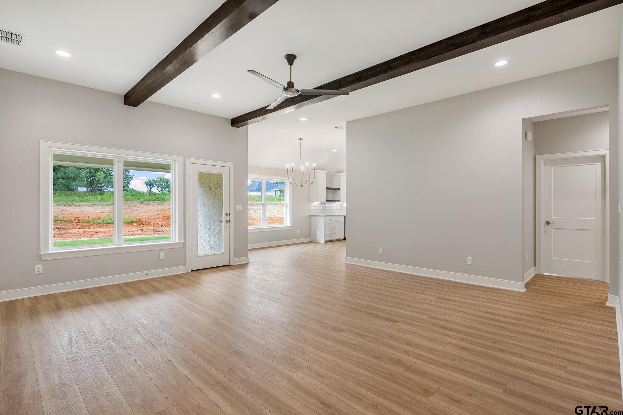 18622-c R 1100 C R 1100 Flint, TX 75762 - Photo 11 of 19 an empty room with wooden floor and windows