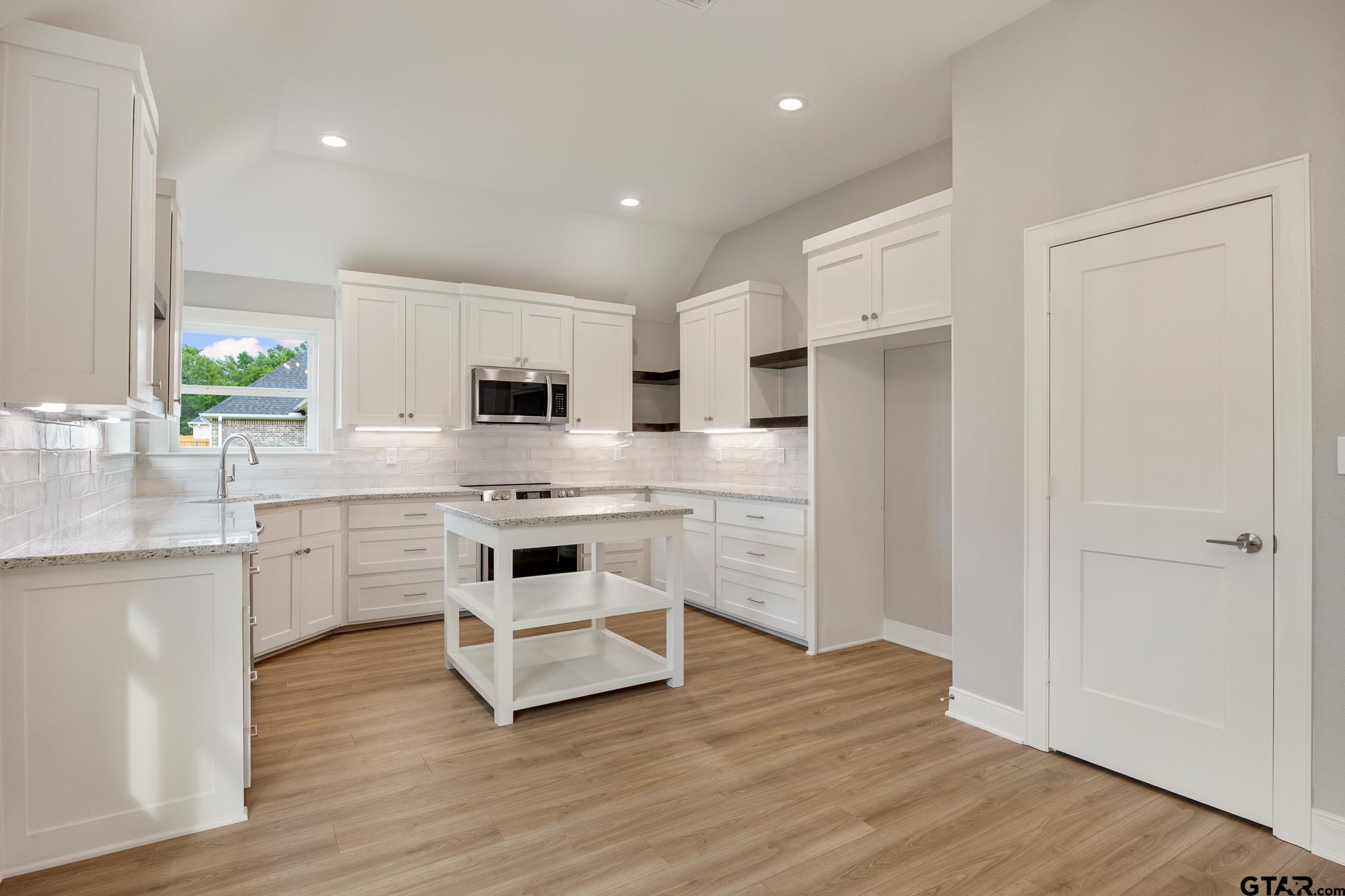18622-c R 1100 C R 1100 Flint, TX 75762 - Photo 13 of 19 a kitchen with white cabinets and stainless steel appliances