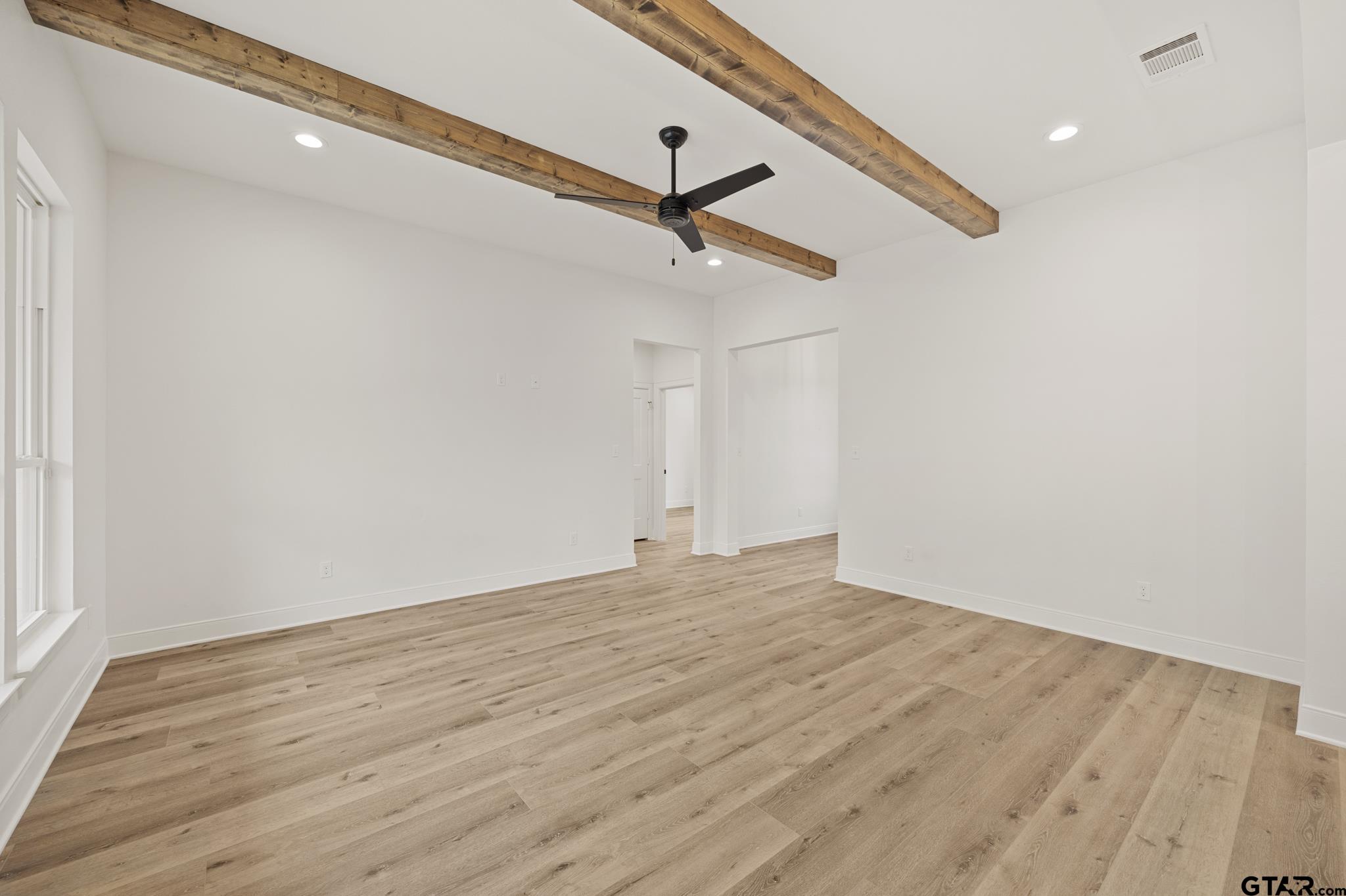 18622-c R 1100 C R 1100 Flint, TX 75762 - Photo 3 of 19 a view of empty room with wooden floor and ceiling fan