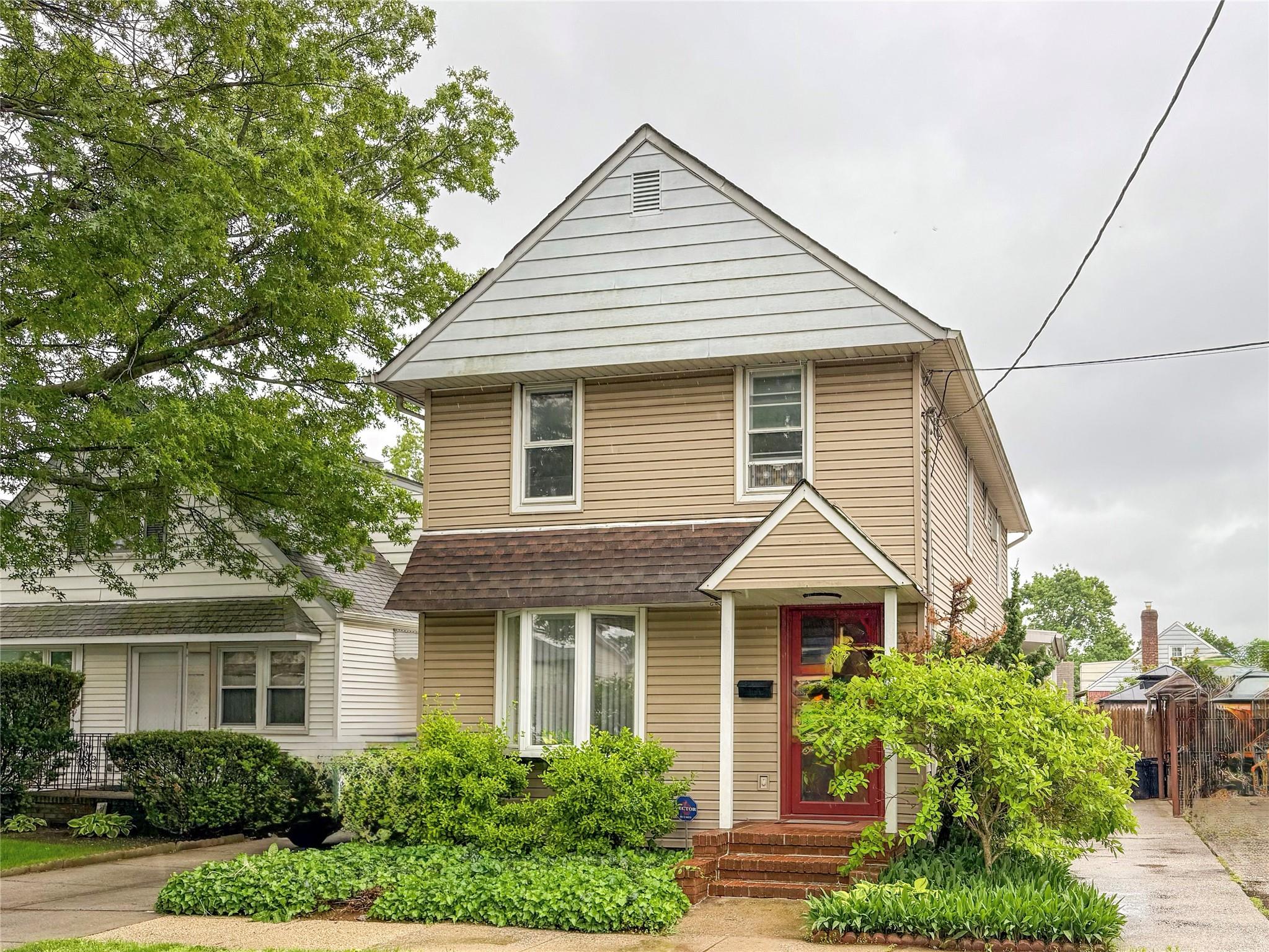 Undisclosed Address Valley Stream, NY 11580 - Photo 1 of 1 Traditional style home with a shingled roof