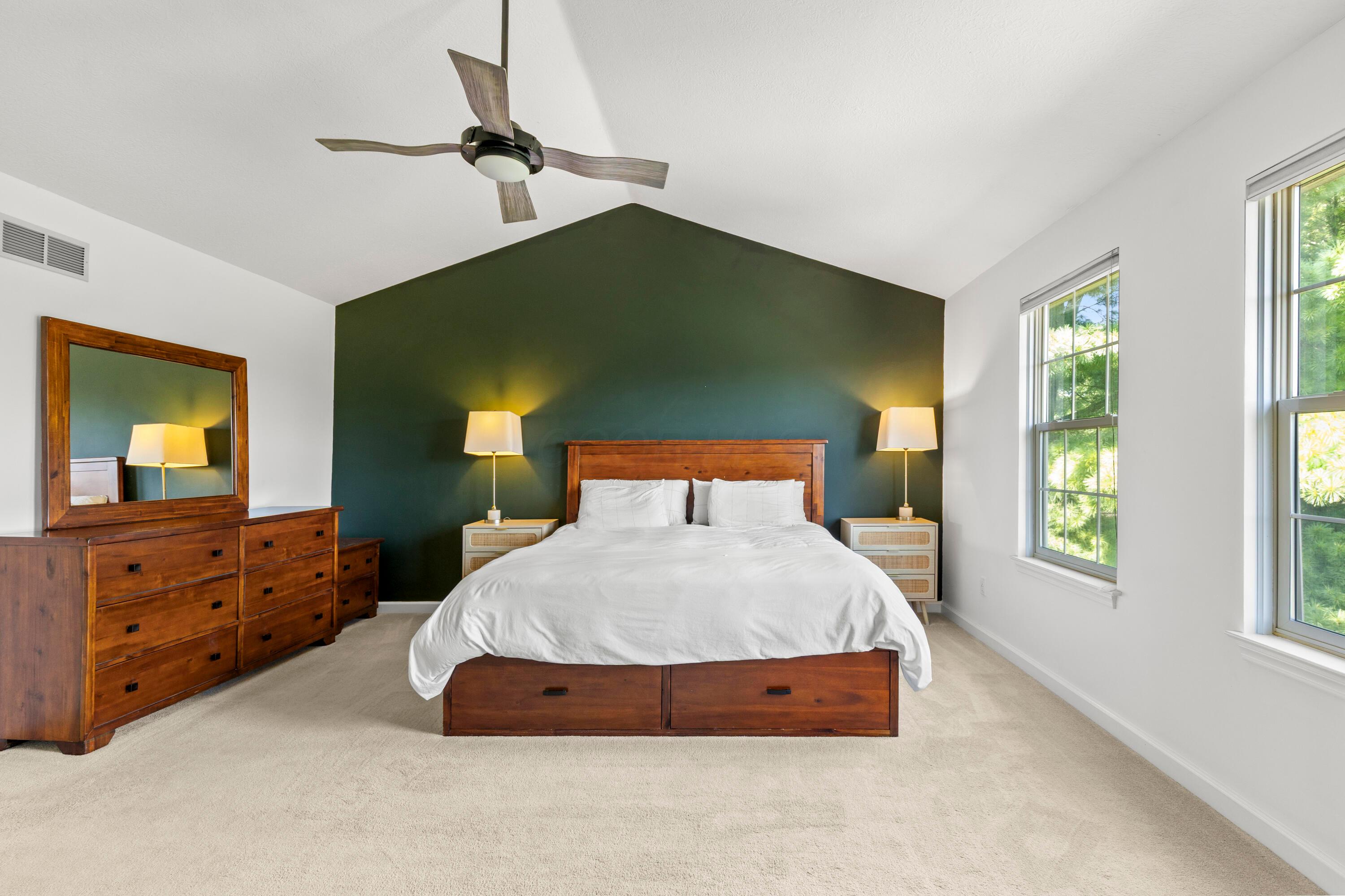 1515 Dale Ford Road Delaware, OH 43015 - Photo 33 of 74 • Light and carpet • Ivory painted & green accent wall • Cathedral ceiling • Lighted ceiling fan • Shades remain