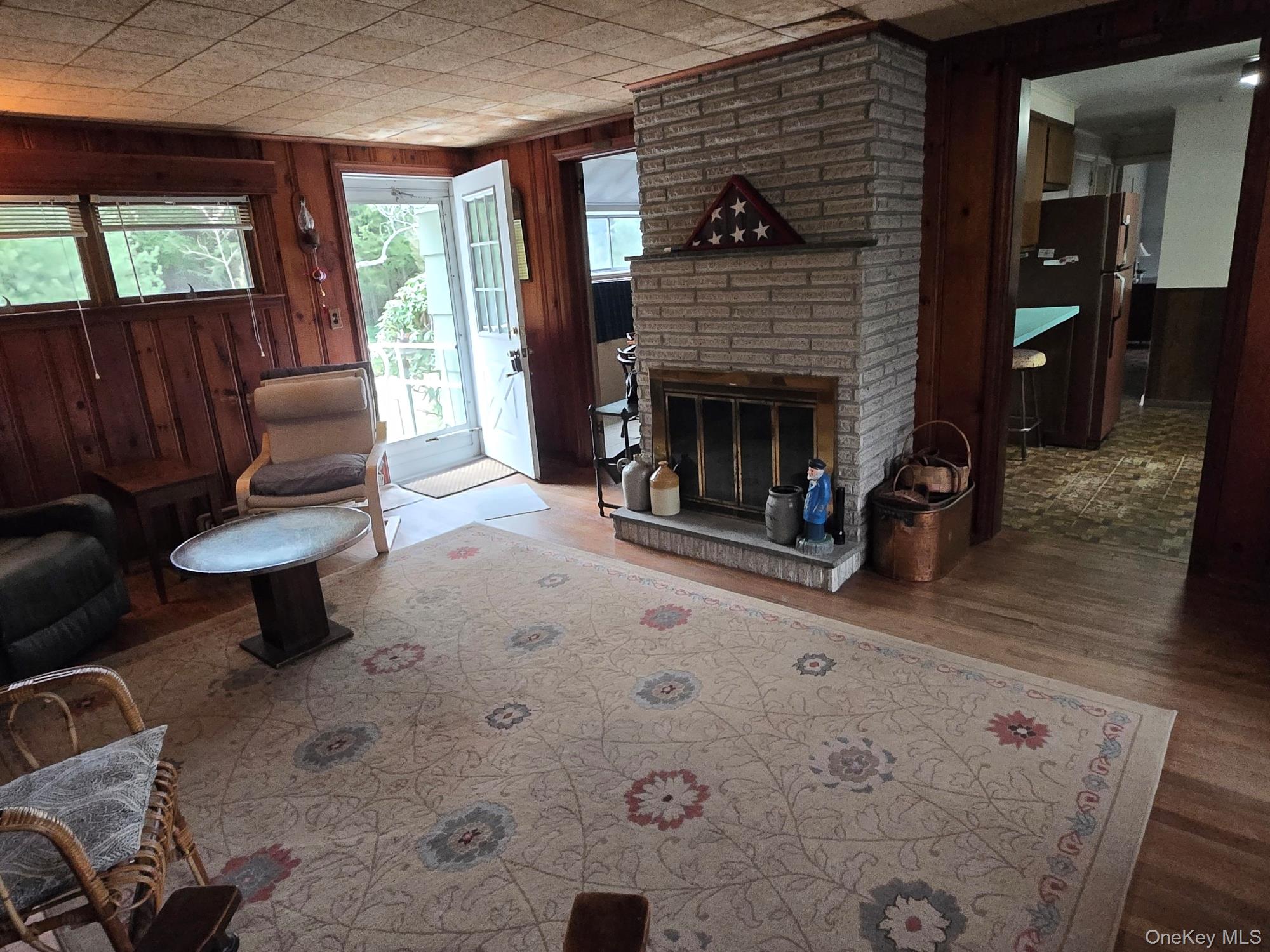 858 Fort Salonga Road Northport, NY 11768 - Photo 2 of 12 a living room with furniture and a fireplace