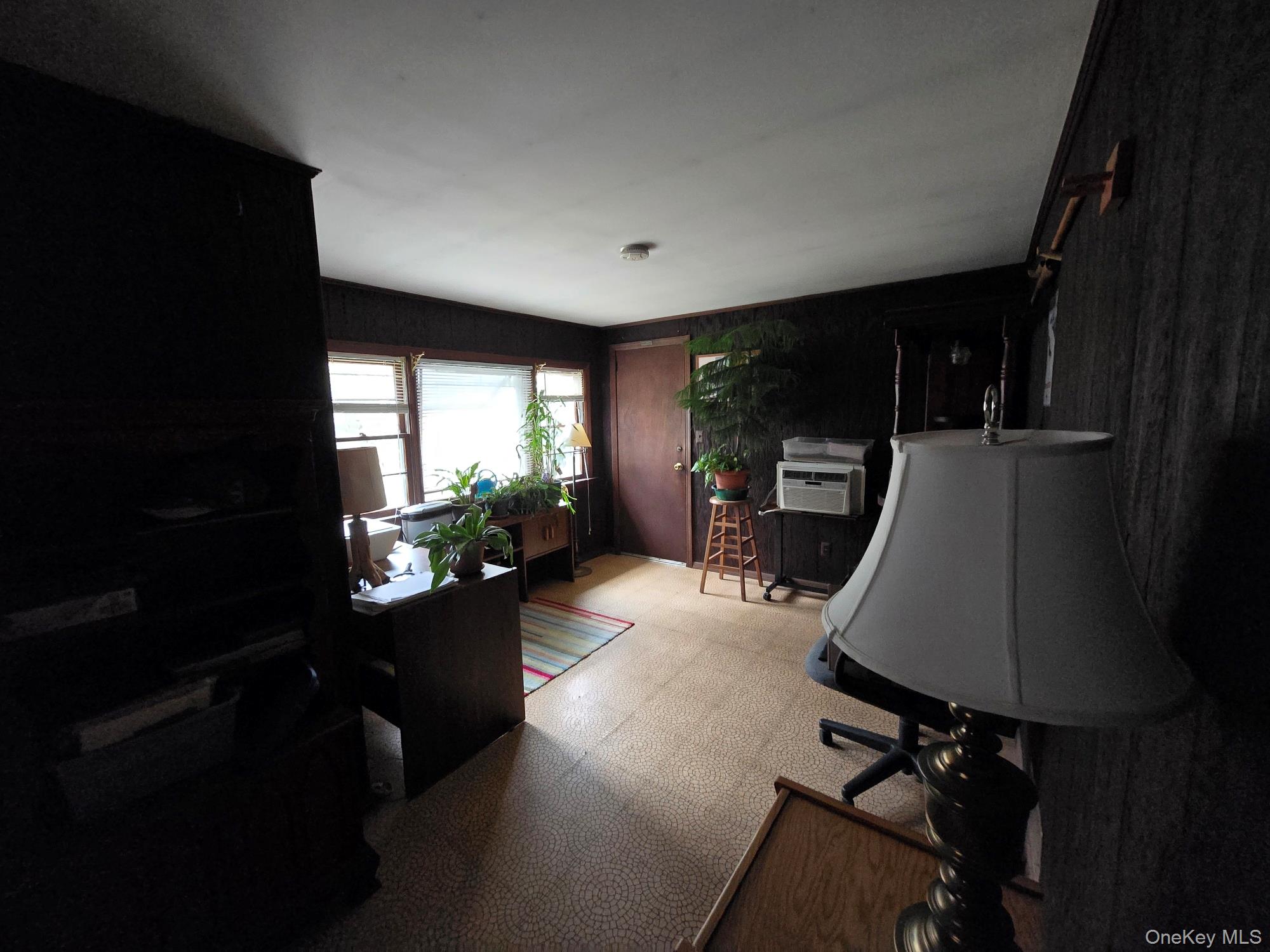 858 Fort Salonga Road Northport, NY 11768 - Photo 4 of 12 a living room with furniture and a flat screen tv