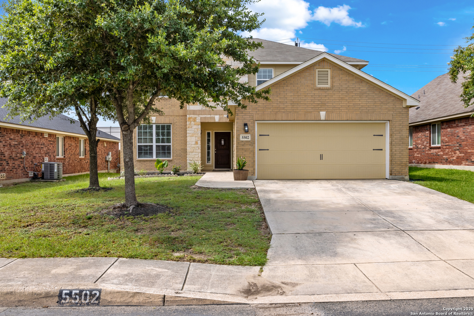 front view of a house with a yard