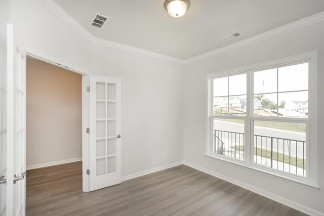 a view of a livingroom with furniture and a window