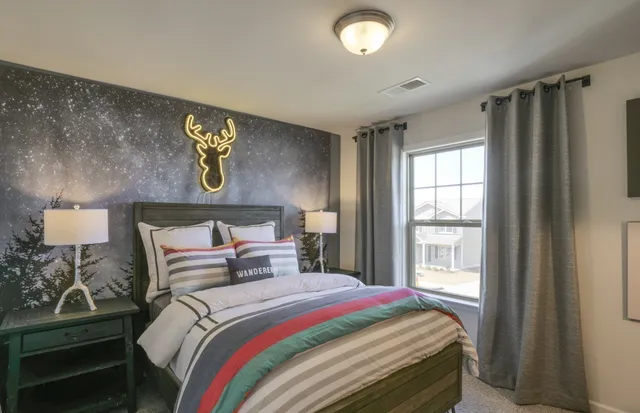 a bedroom with a bed and a chair