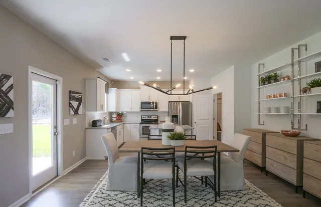 a living room with furniture and a table