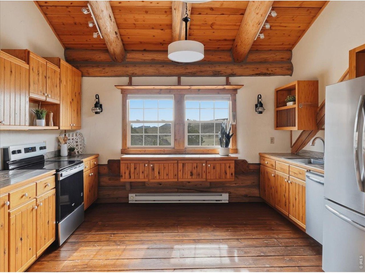 1652 Eiger Road Livermore, CO 80536 - Photo 19 of 50 Kitchen facing your sunrise. New Stove, New Dishwasher! Fridge new in 2025.